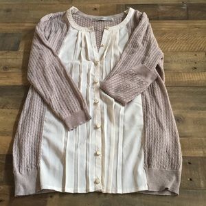 Unique cardigan with pleated front panels.